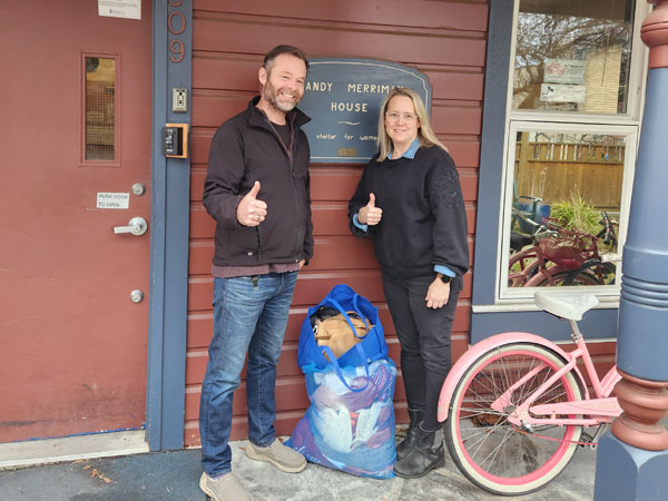 Don St Germain donating clothing to Sandy Merriman House
